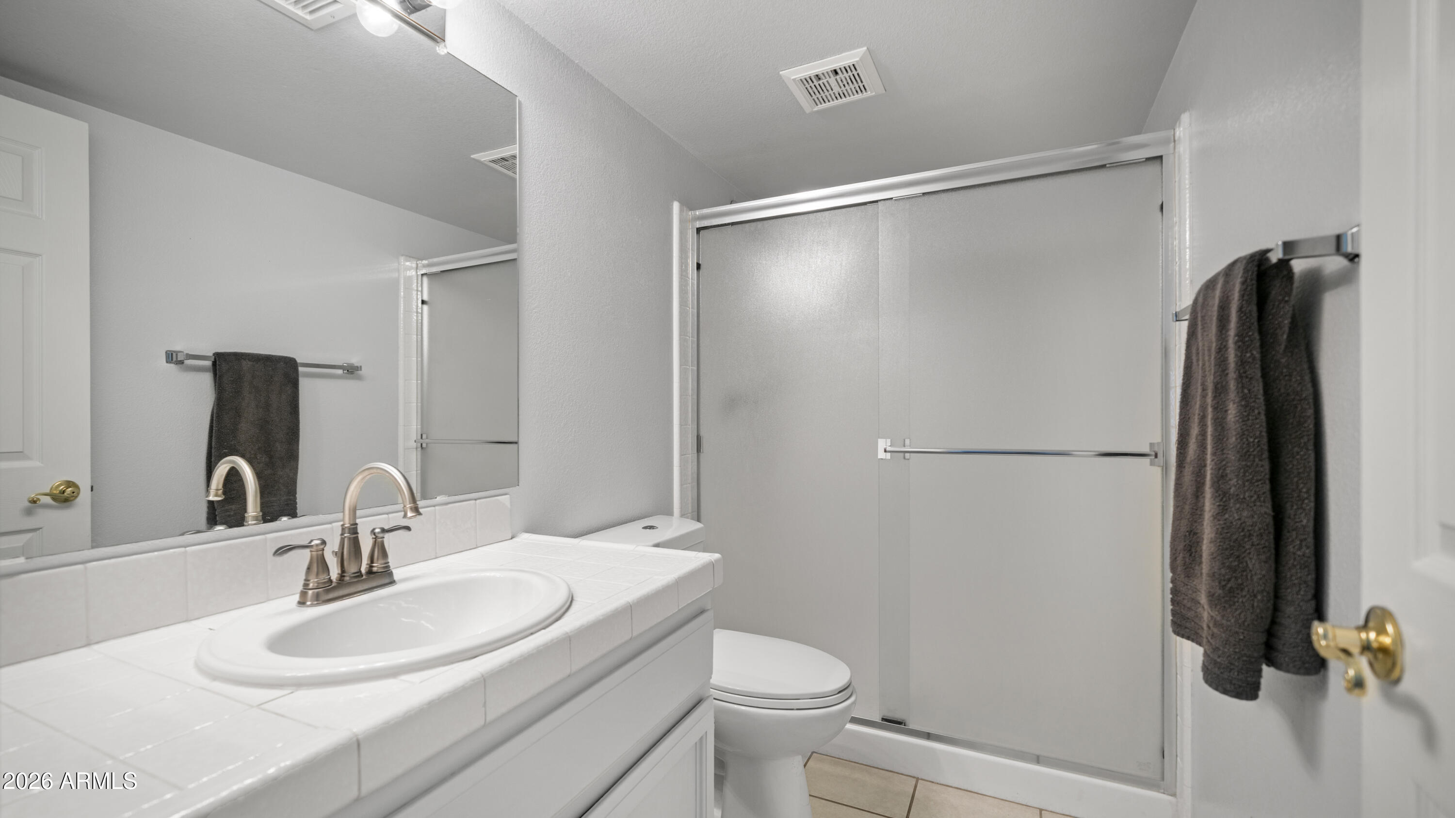 6620 West Redfield Road Glendale, AZ 85306 - Photo 23 of 33 a bathroom with a sink toilet and shower