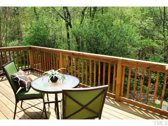 5843 Branchwood Road Raleigh, NC 27609 - Photo 14 of 25 a balcony with table and chairs