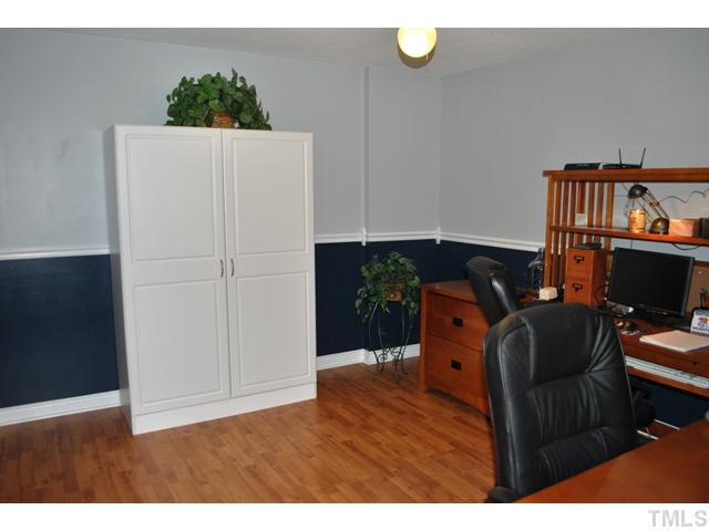 5843 Branchwood Road Raleigh, NC 27609 - Photo 19 of 25 a living room with furniture and a wooden floor