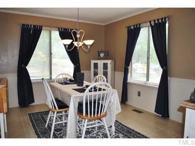 5843 Branchwood Road Raleigh, NC 27609 - Photo 6 of 25 a view of a dining room with furniture and window