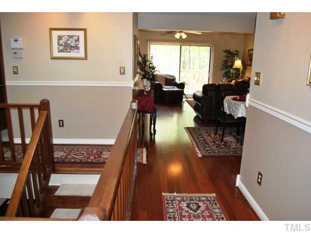 5843 Branchwood Road Raleigh, NC 27609 - Photo 8 of 25 a living room with furniture floor to ceiling window and a potted plant