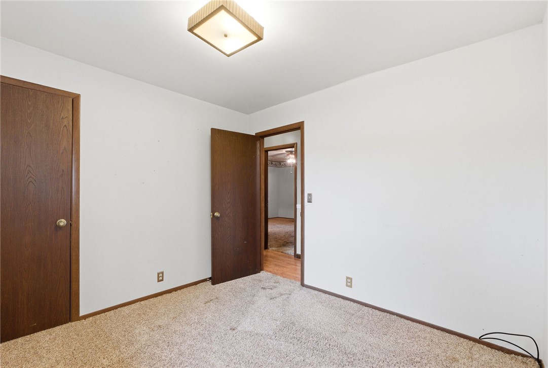 6711 Hamilton-Middletown Road Franklin, OH 45005 - Photo 22 of 49 This cozy bedroom features plush carpeting, offering a comfortable and inviting retreat.