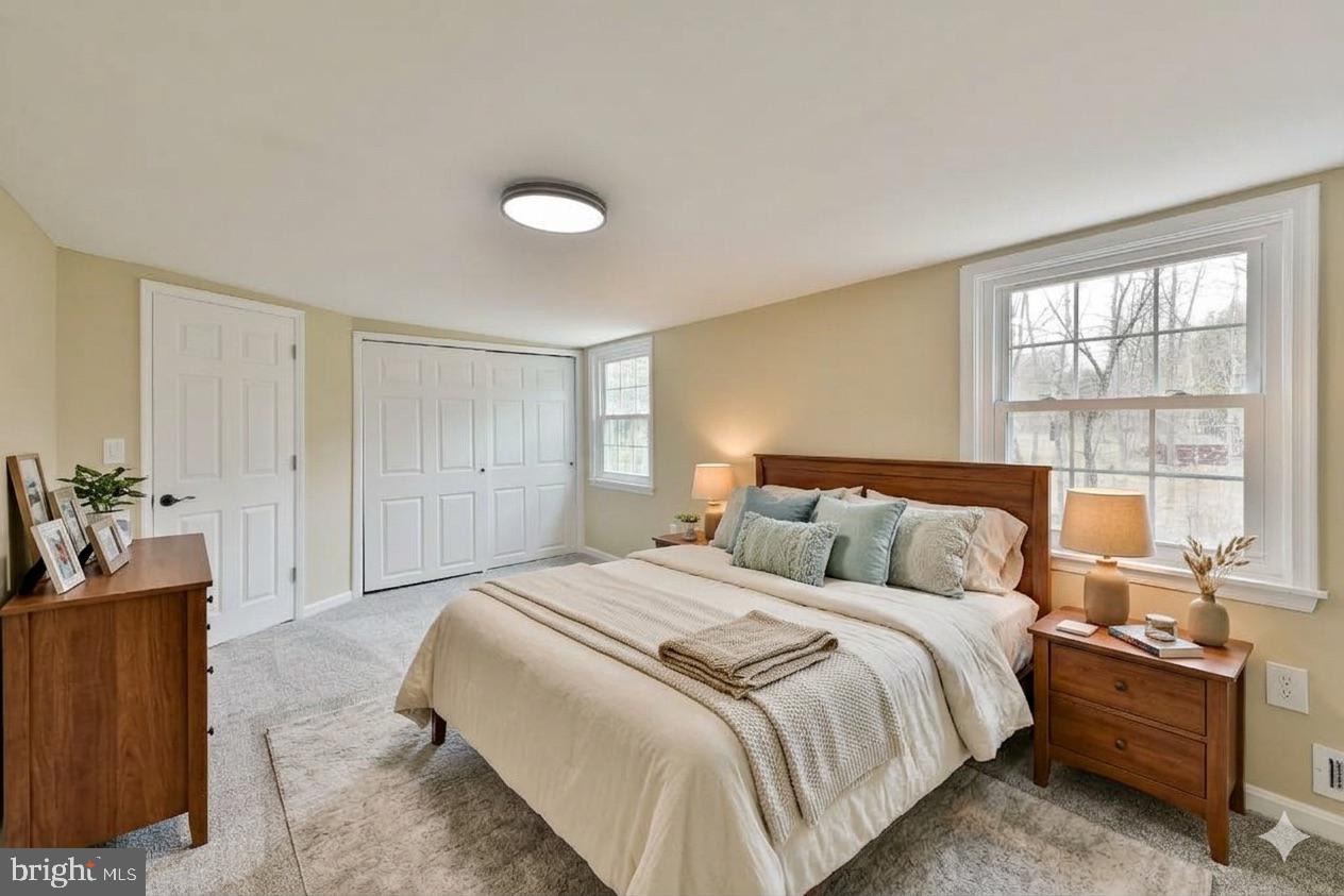 6166 Mechanicsville Road Doylestown, PA 18902 - Photo 16 of 29 a bedroom with a bed and a couch