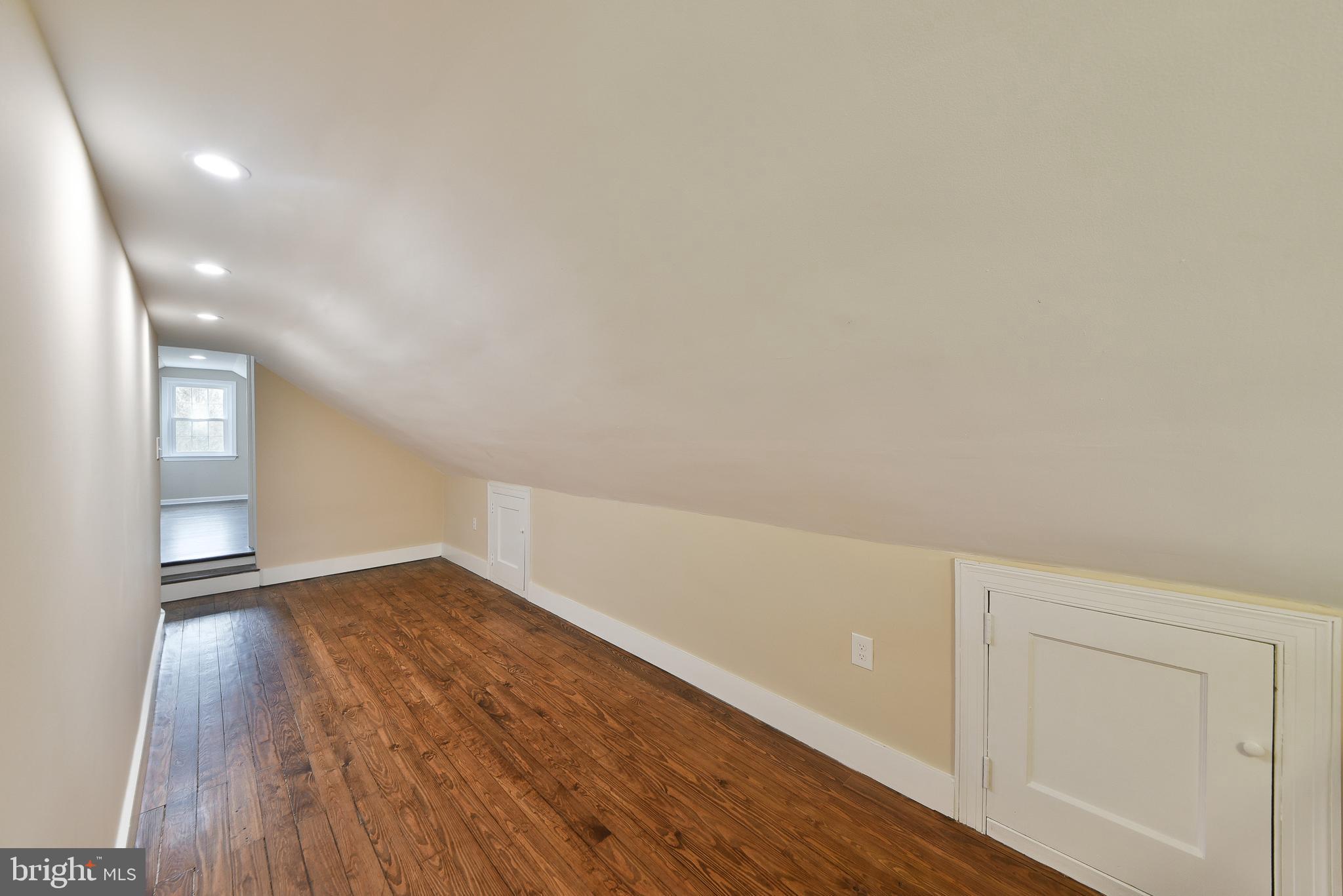 6166 Mechanicsville Road Doylestown, PA 18902 - Photo 21 of 29 a view of an empty room and wooden floor