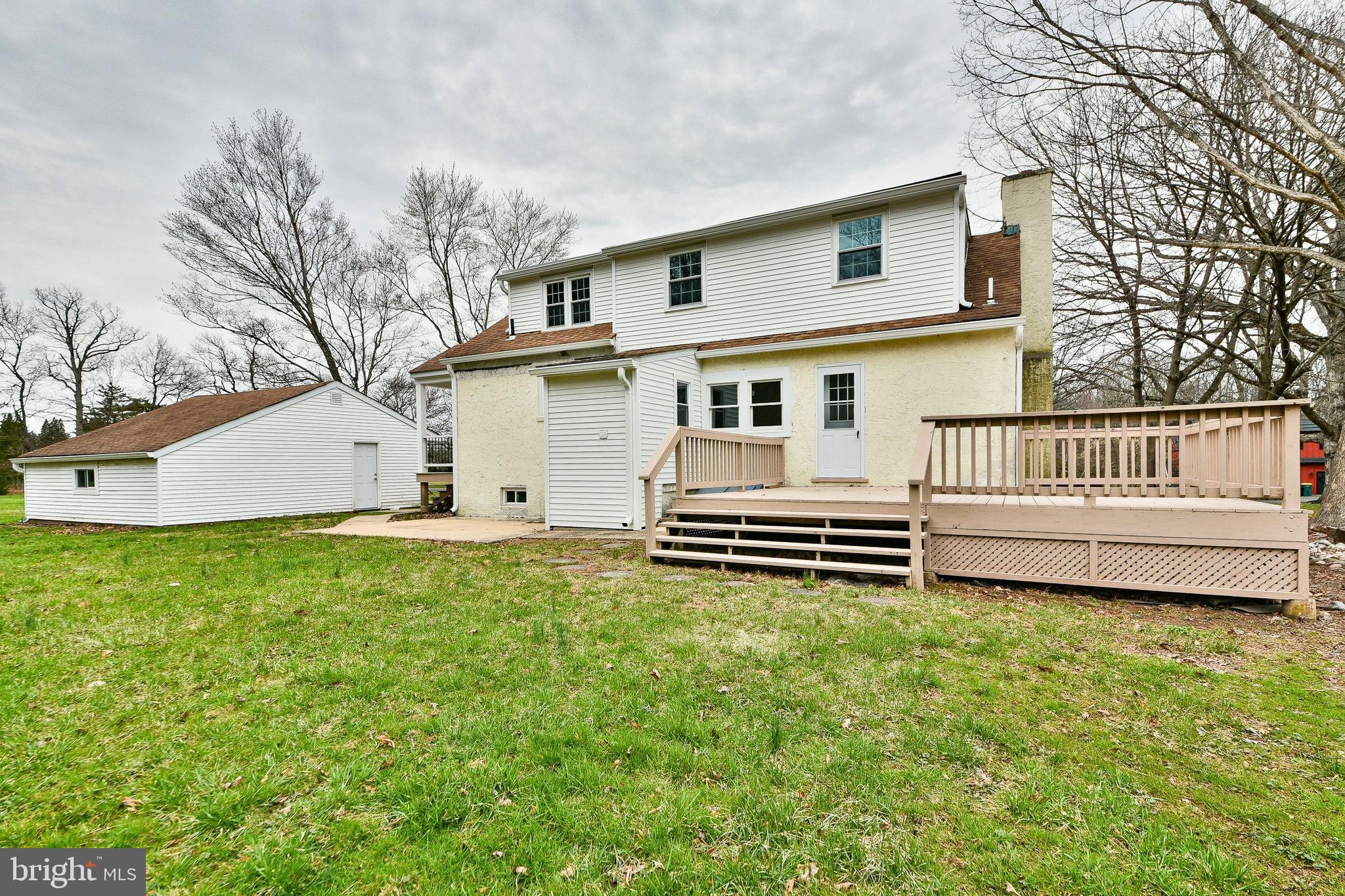 6166 Mechanicsville Road Doylestown, PA 18902 - Photo 27 of 29 a white house that has a big yard and a large tree