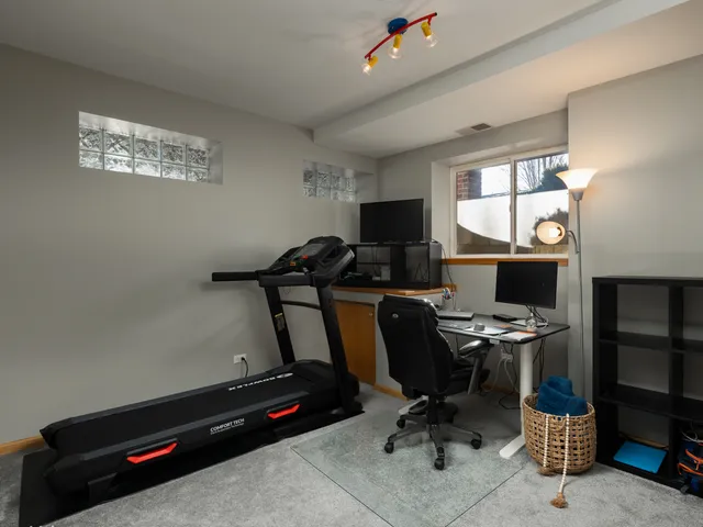 a view of workspace with windows gym equipment