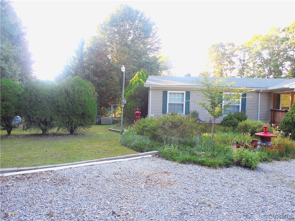 10322 Colemans Lake Road Ford, VA 23850 - Photo 5 of 49 a view of a house with a garden