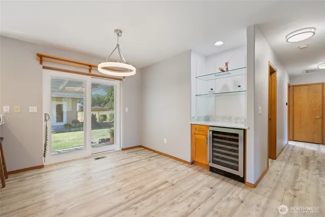 a kitchen with granite countertop a sink and cabinets