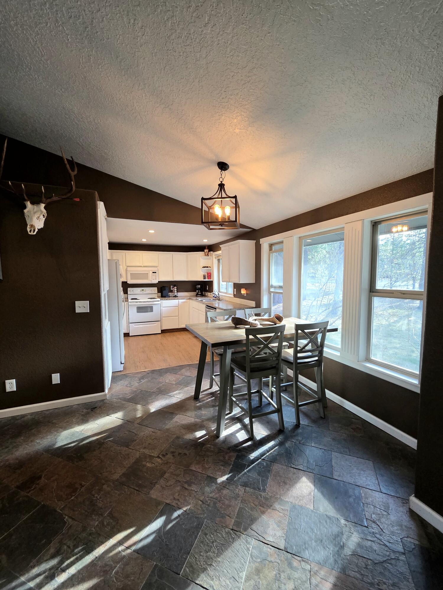 53156 Day Road La Pine, OR 97739 - Photo 15 of 28 Dining area, with windows to provide natural light.