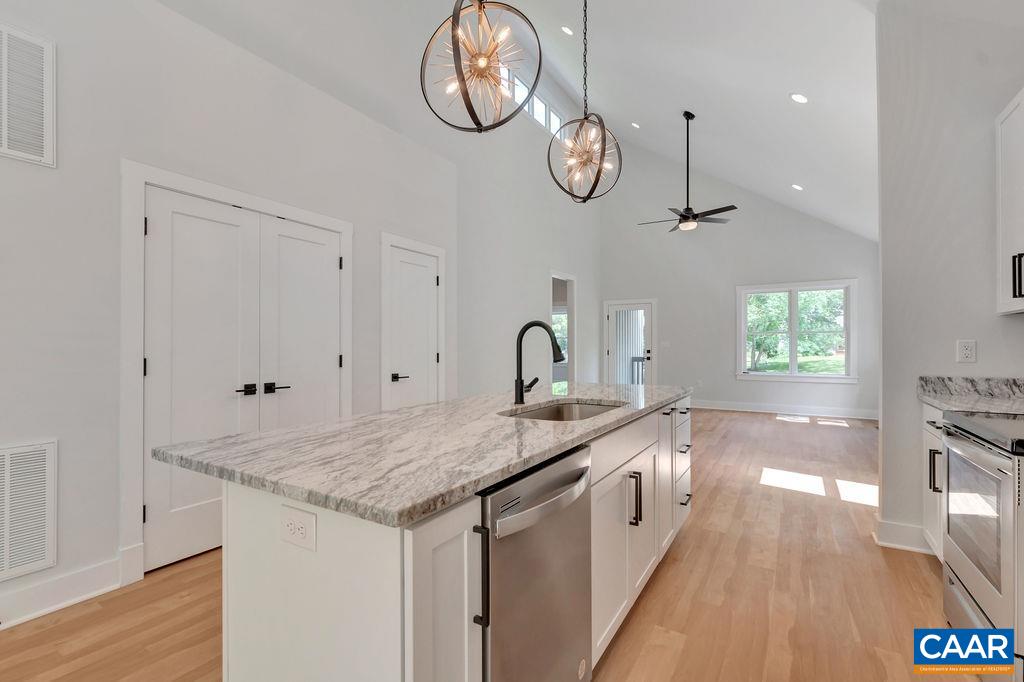 24 Begum Road Palmyra, VA 22963 - Photo 22 of 47 a kitchen with a sink cabinets and wooden floor
