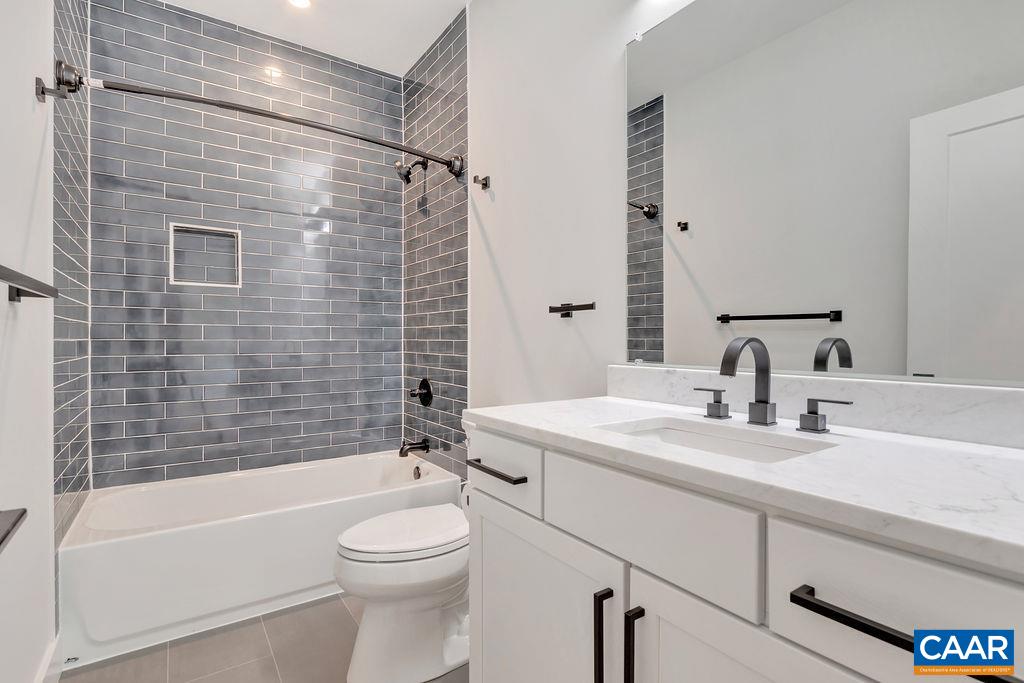 24 Begum Road Palmyra, VA 22963 - Photo 35 of 47 a bathroom with a sink a toilet and shower