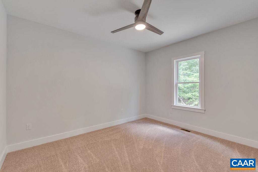24 Begum Road Palmyra, VA 22963 - Photo 36 of 47 wooden floor in an empty room with a window