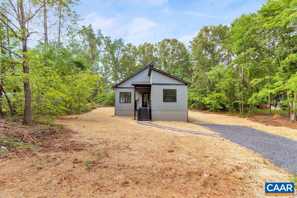 24 Begum Road Palmyra, VA 22963 - Photo 4 of 47 a yellow and red house with a outdoor space