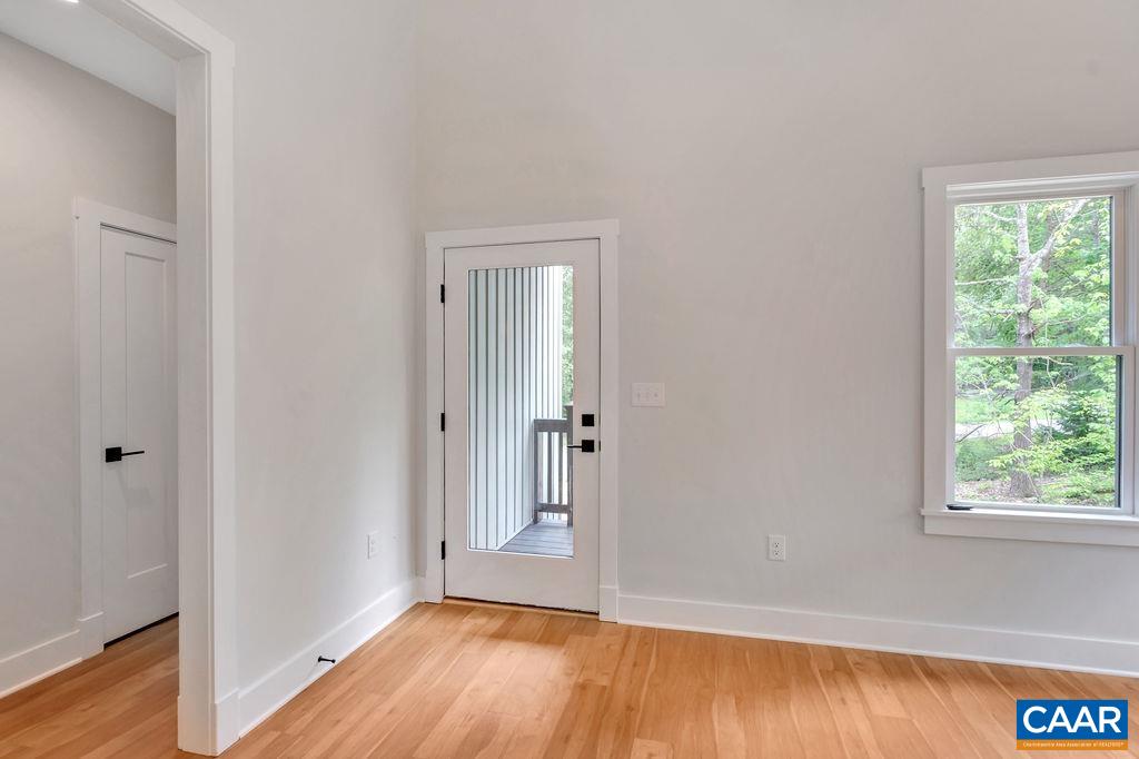 24 Begum Road Palmyra, VA 22963 - Photo 9 of 47 a view of an empty room with wooden floor and a window