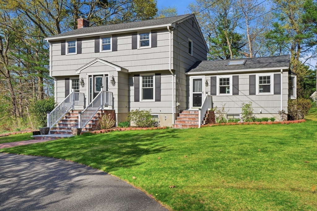 3 Fairway Drive Canton, MA 02021 - Photo 1 of 34 a front view of a house with a garden