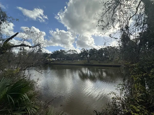 a view of lake with green space
