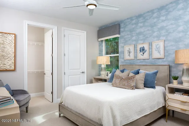 a bedroom with a bed and a chair