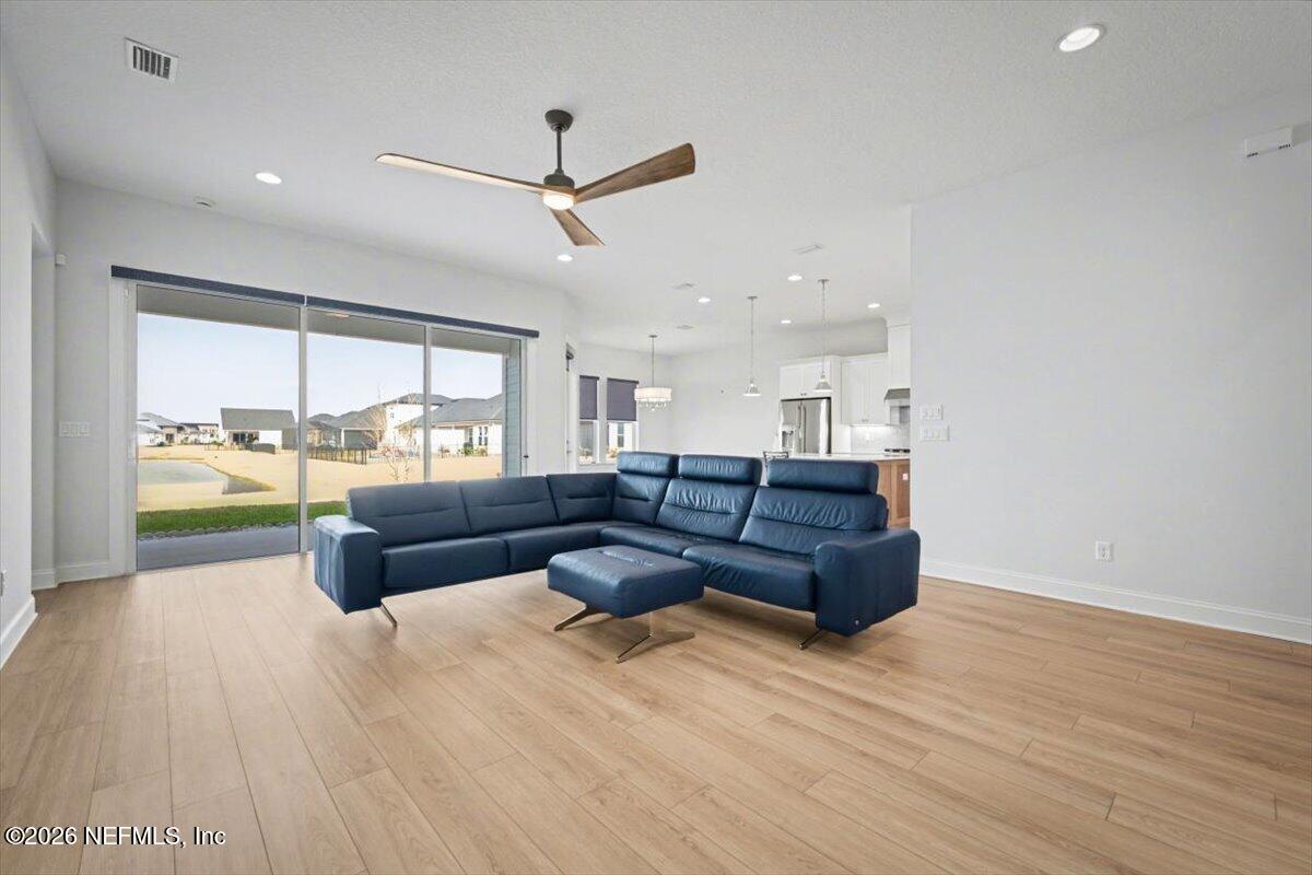 113 Grand Rivage Drive St. Augustine, FL 32092 - Photo 13 of 24 a living room with furniture and a large window