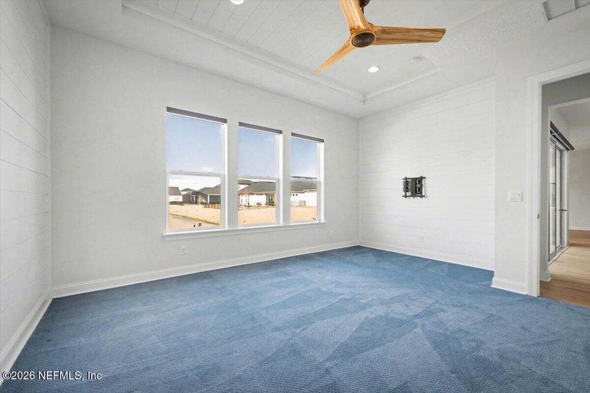 113 Grand Rivage Drive St. Augustine, FL 32092 - Photo 18 of 22 an empty room with a empty space and windows