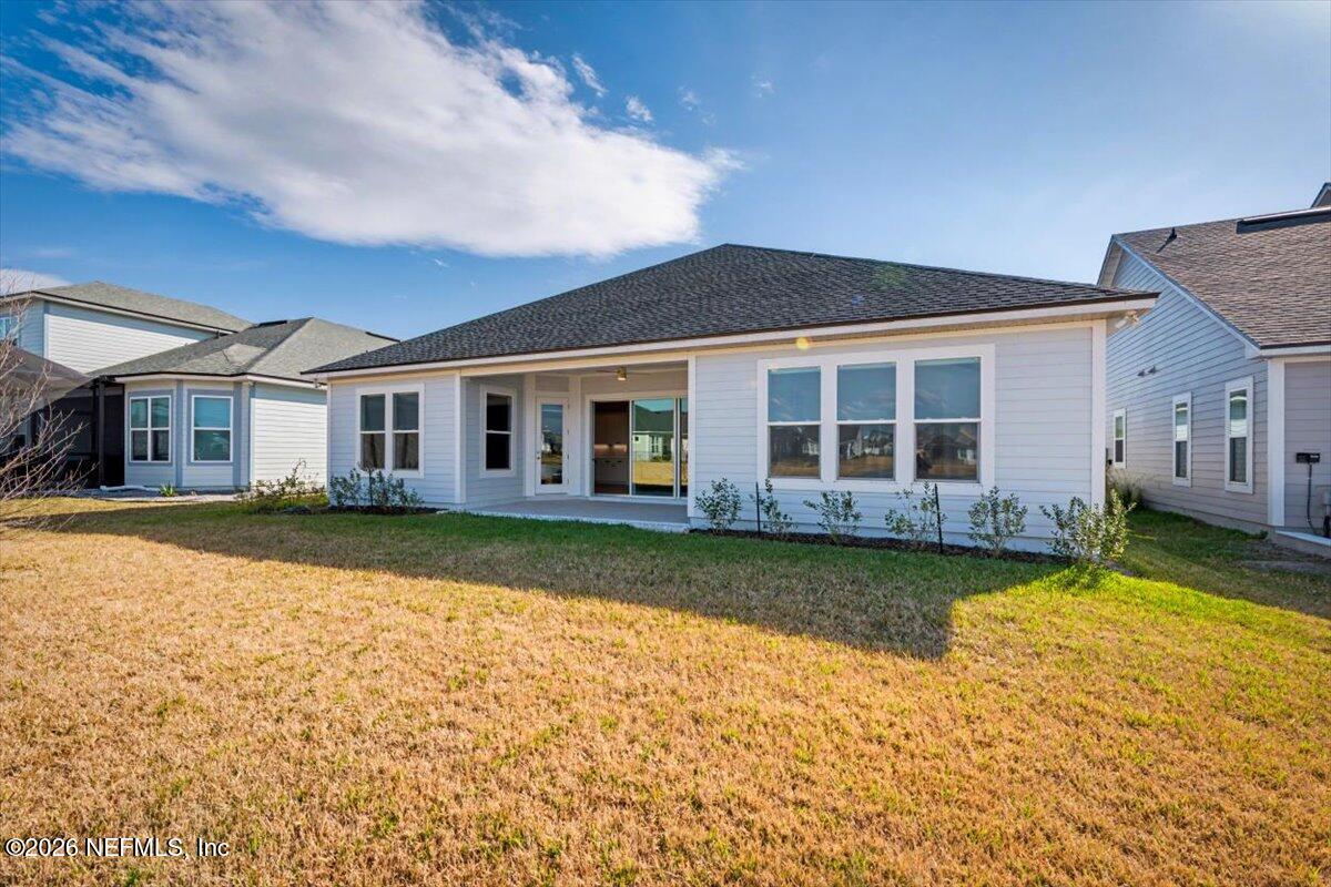 113 Grand Rivage Drive St. Augustine, FL 32092 - Photo 21 of 22 front view of a house with a yard