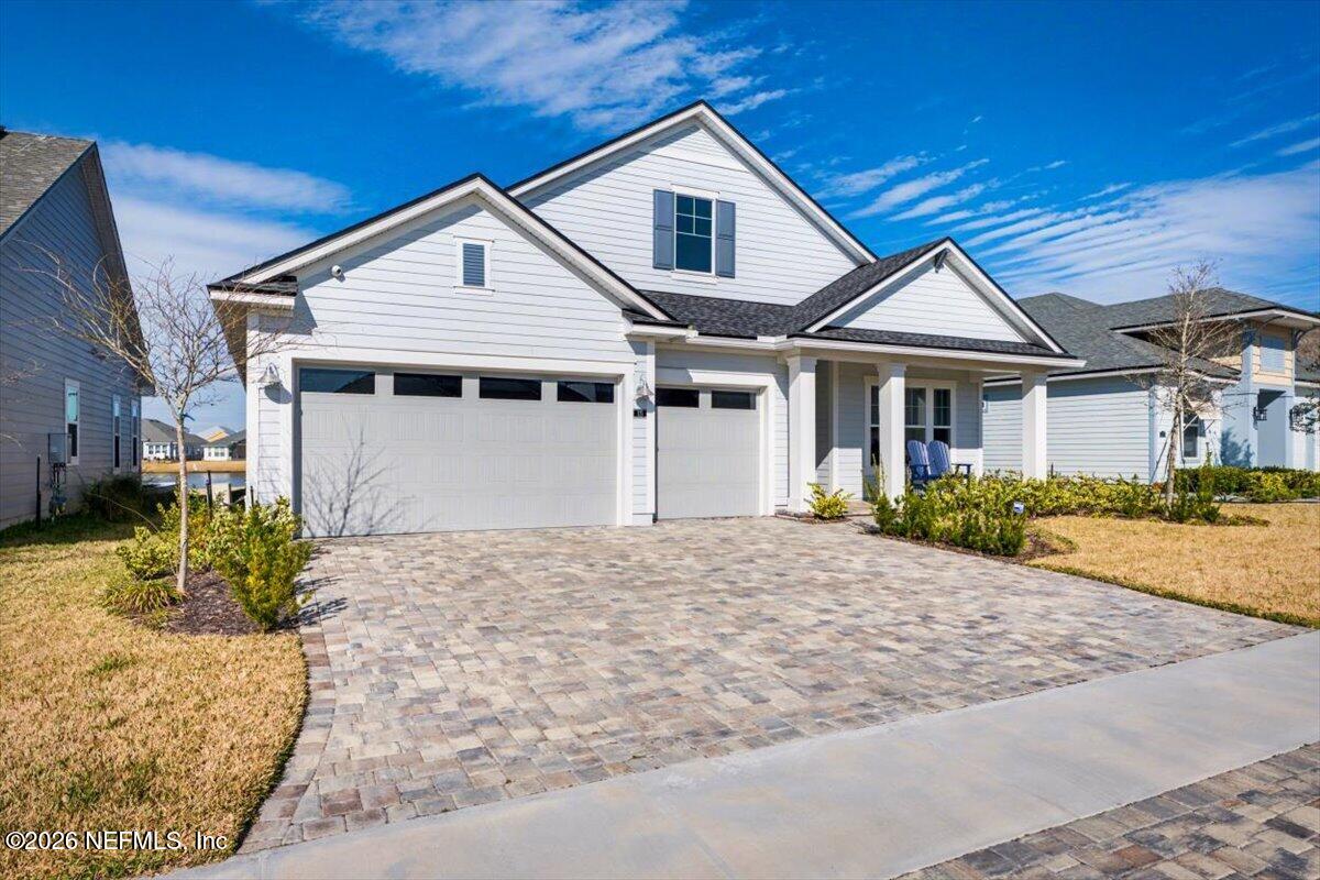 113 Grand Rivage Drive St. Augustine, FL 32092 - Photo 3 of 24 a front view of a house with a yard