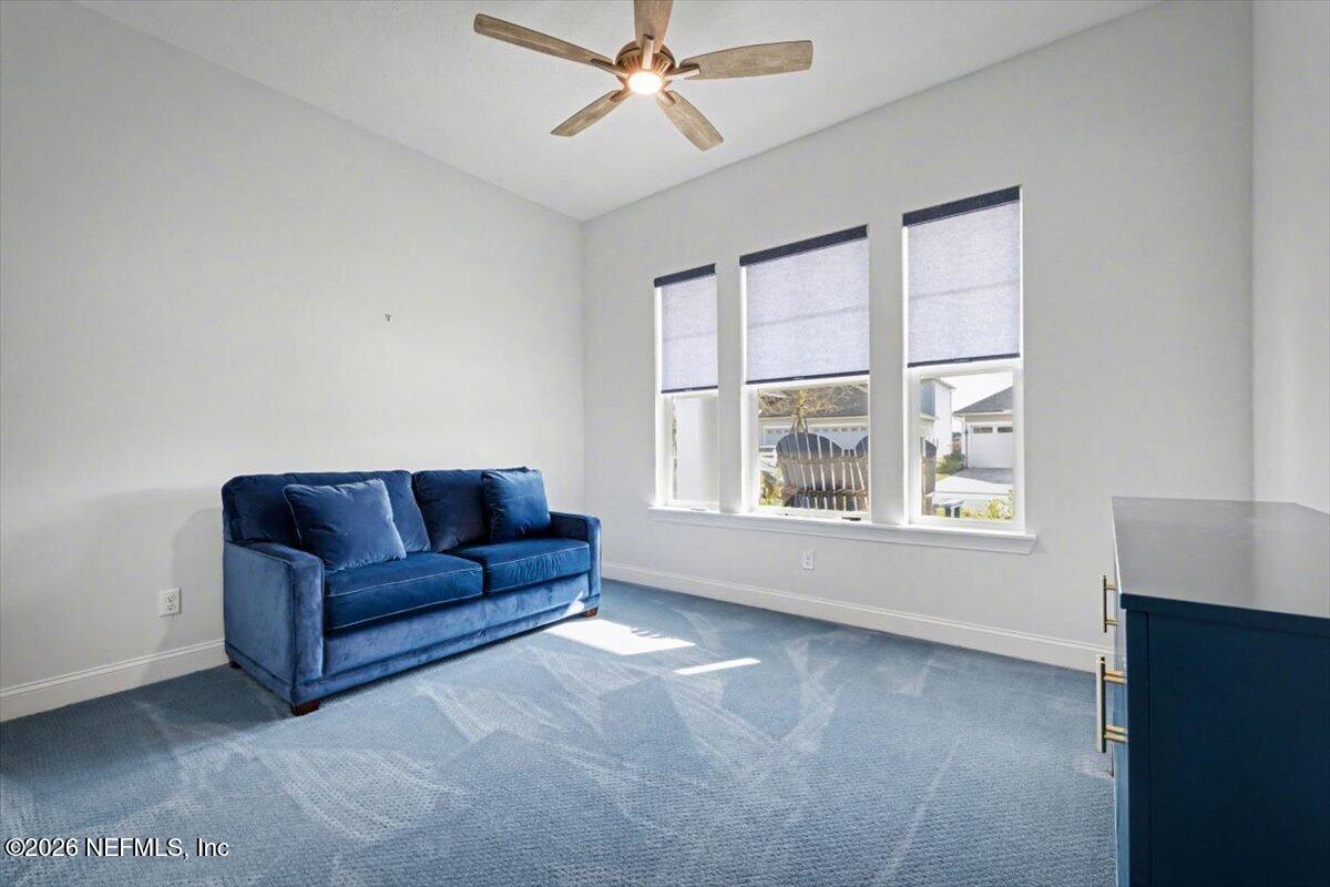 113 Grand Rivage Drive St. Augustine, FL 32092 - Photo 7 of 24 a living room with furniture and a window