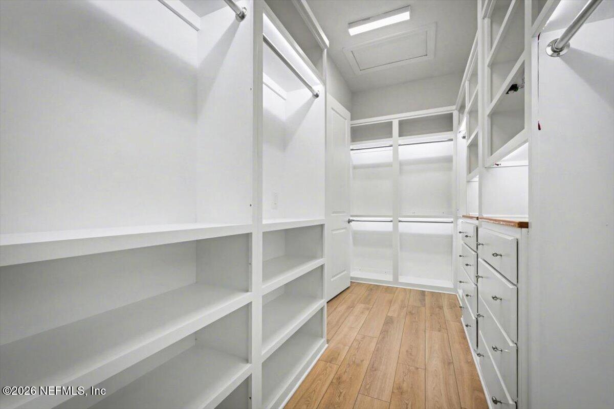 113 Grand Rivage Drive St. Augustine, FL 32092 - Photo 10 of 22 a walk in closet with wooden floor