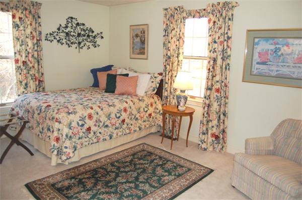 710 Barretts Mill Road Concord, MA 01742 - Photo 16 of 21 a bedroom with a bed and a couch