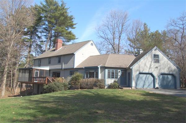 710 Barretts Mill Road Concord, MA 01742 - Photo 21 of 21 a front view of a house with a garden