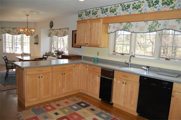 710 Barretts Mill Road Concord, MA 01742 - Photo 8 of 21 a kitchen with a sink stove and cabinets