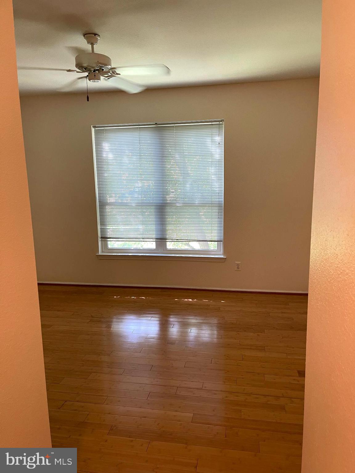 1601 Spring Gate Dr., Unit 1214 McLean, VA 22102 - Photo 11 of 17 a view of empty room with wooden floor and fan