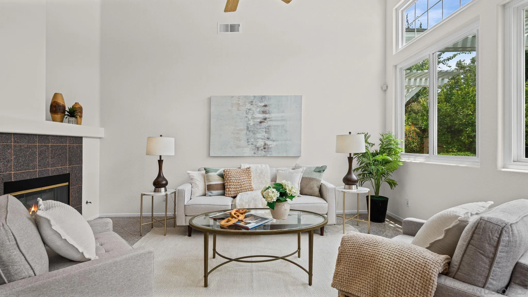 1783 Medinah Road San Marcos, CA 92069 - Photo 12 of 39 a living room with furniture a fireplace and a large window