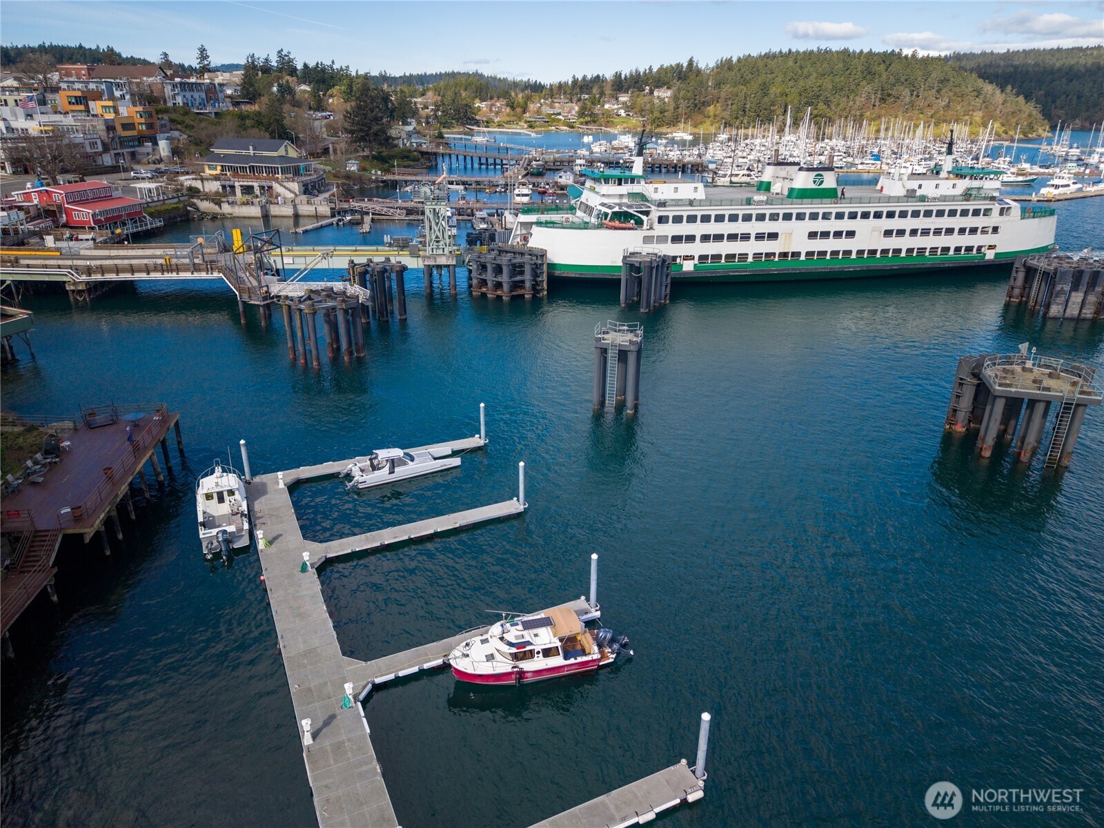 0 Warbass Way, Unit 5 Friday Harbor, WA 98250 - Photo 14 of 22 a view of a lake with couches chairs and a table