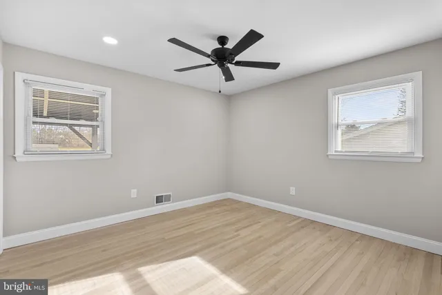 a view of a ceiling fan with wooden floor