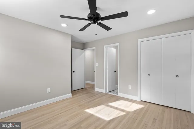 a view of livingroom with hardwood floor and ceiling fan