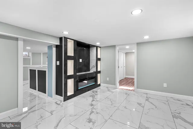 a view of a hallway with wooden shelves