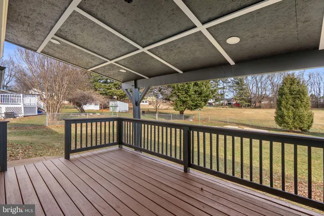 a view of a balcony with wooden floor