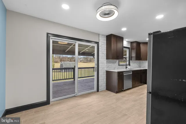 a bathroom with a sink and a large mirror