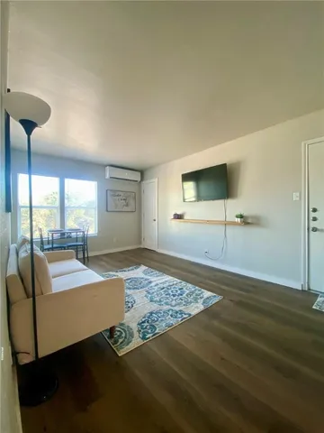 a view of a livingroom with furniture and window