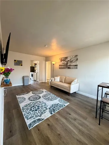 a living room with furniture and a rug