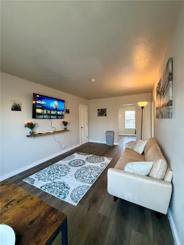 a living room with furniture and a rug