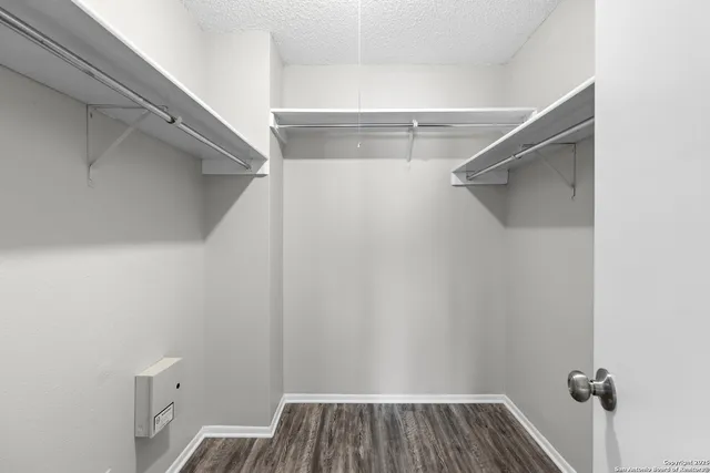 a view of a room with racks on the wall