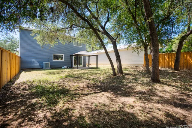 a house with trees in front of it