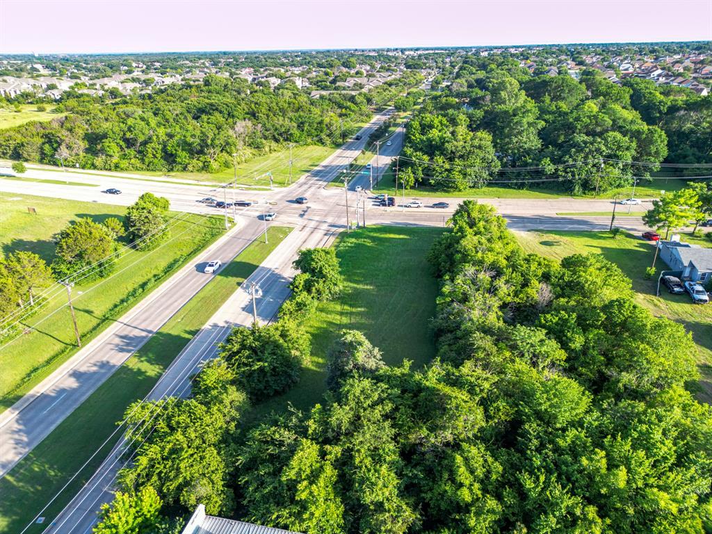 727 East Pleasant Run Road Cedar Hill, TX 75104 - Photo 17 of 23 a view of a garden with a lake