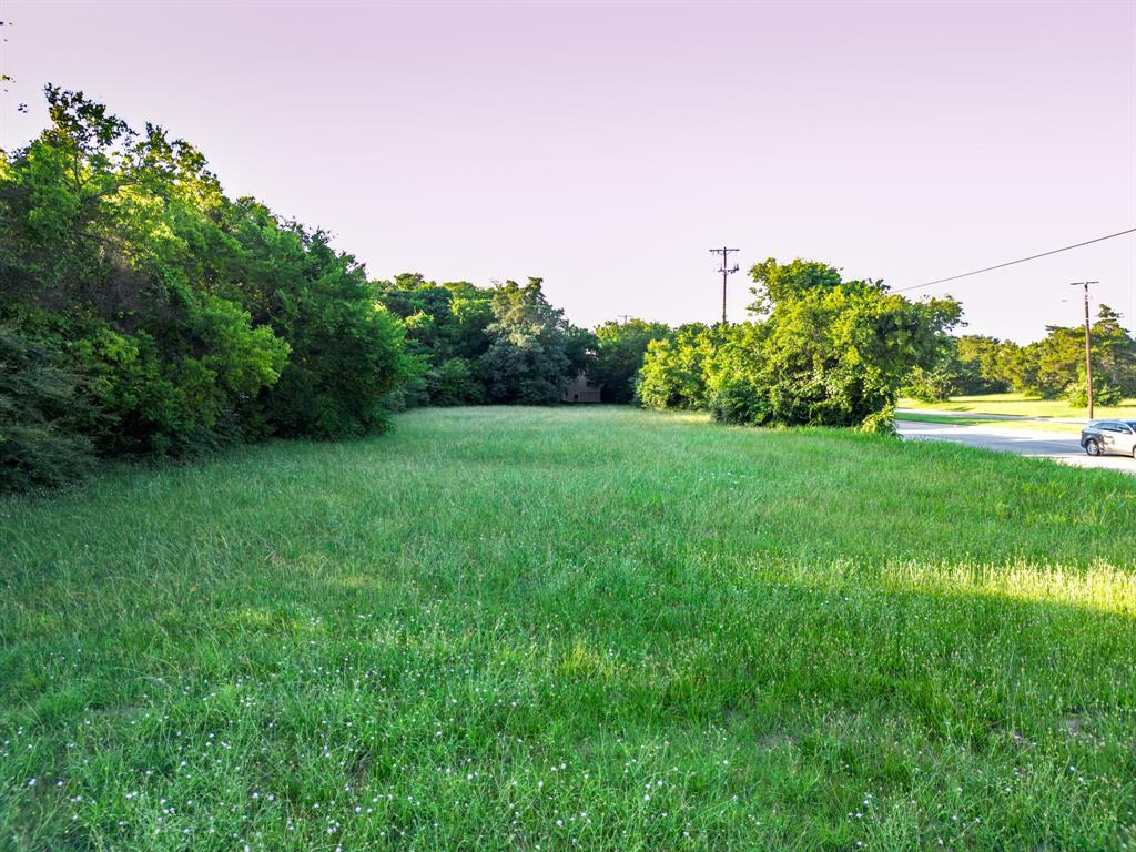 727 East Pleasant Run Road Cedar Hill, TX 75104 - Photo 2 of 23 a view of a grassy field with trees