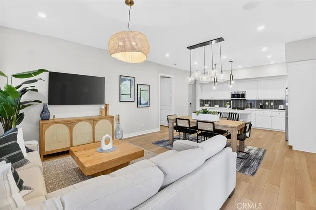 a kitchen with stainless steel appliances a sink and cabinets