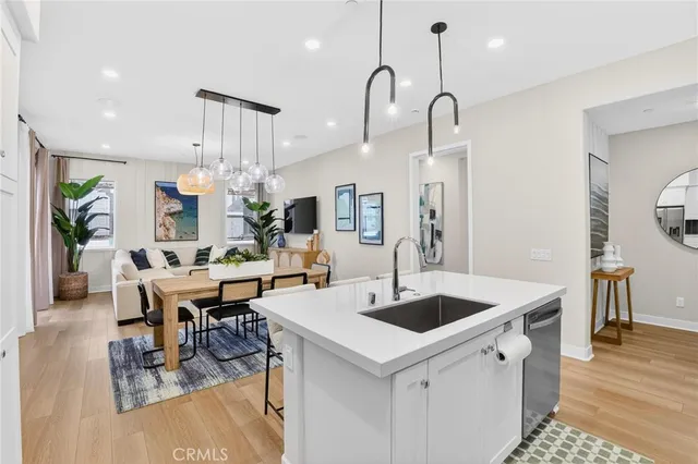 a kitchen with a sink a counter and cabinets
