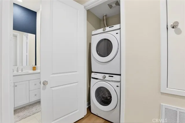 a view of a patio with a table and chairs under an umbrella