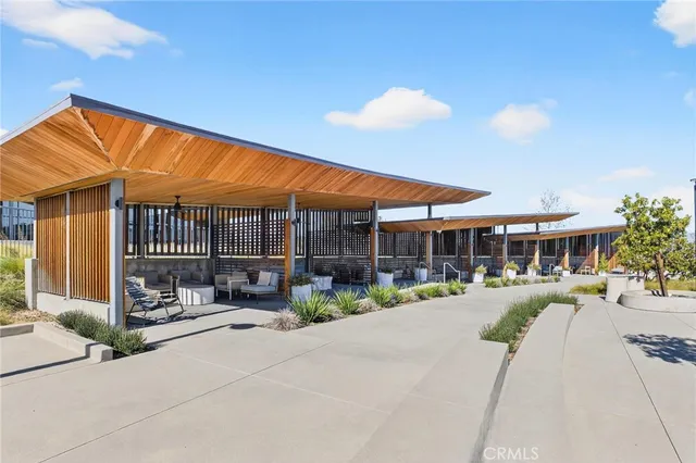 a view of swimming pool with outdoor seating and city view