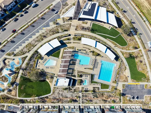 a view of a swimming pool and lounge chairs